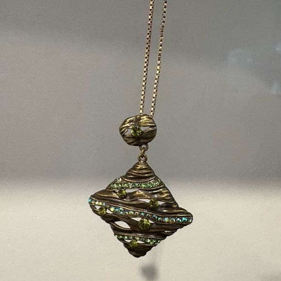 Wavy Textured Gold-Tone Pendant with
Sparkling Green Gems - Picture 8 of 9